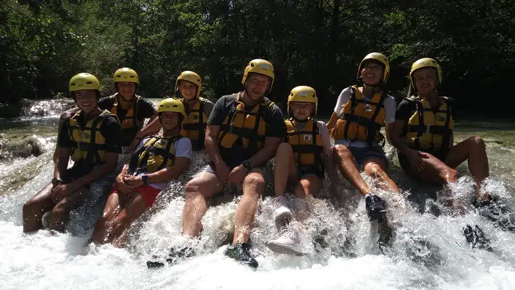 A group during a river hiking experience in Chianti along the Elsa River.